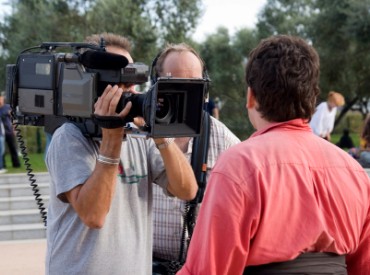 Cameraman Filming an Interview