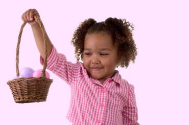 Girl Holding an Easter Basket Filled with Pink and Purple Eggs