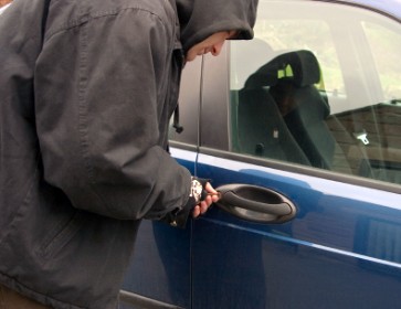 Thief Stealing a Car