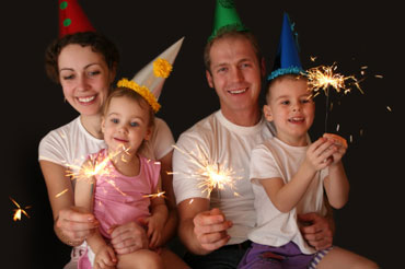 Family Celebrating New Year's with Sparklers