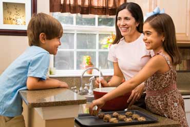 Mom and Kids Baking Cookies