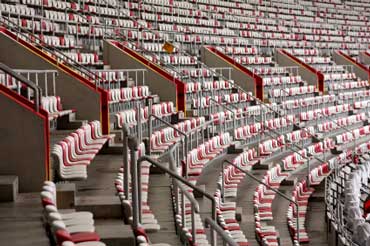 Empty Stadium Seats Before a Football Game