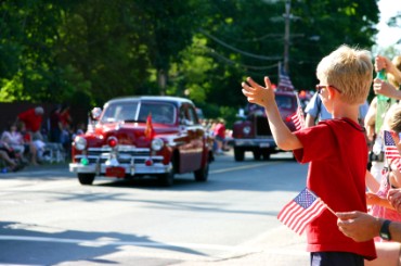 A Boy Watching a Fourth of July Parade